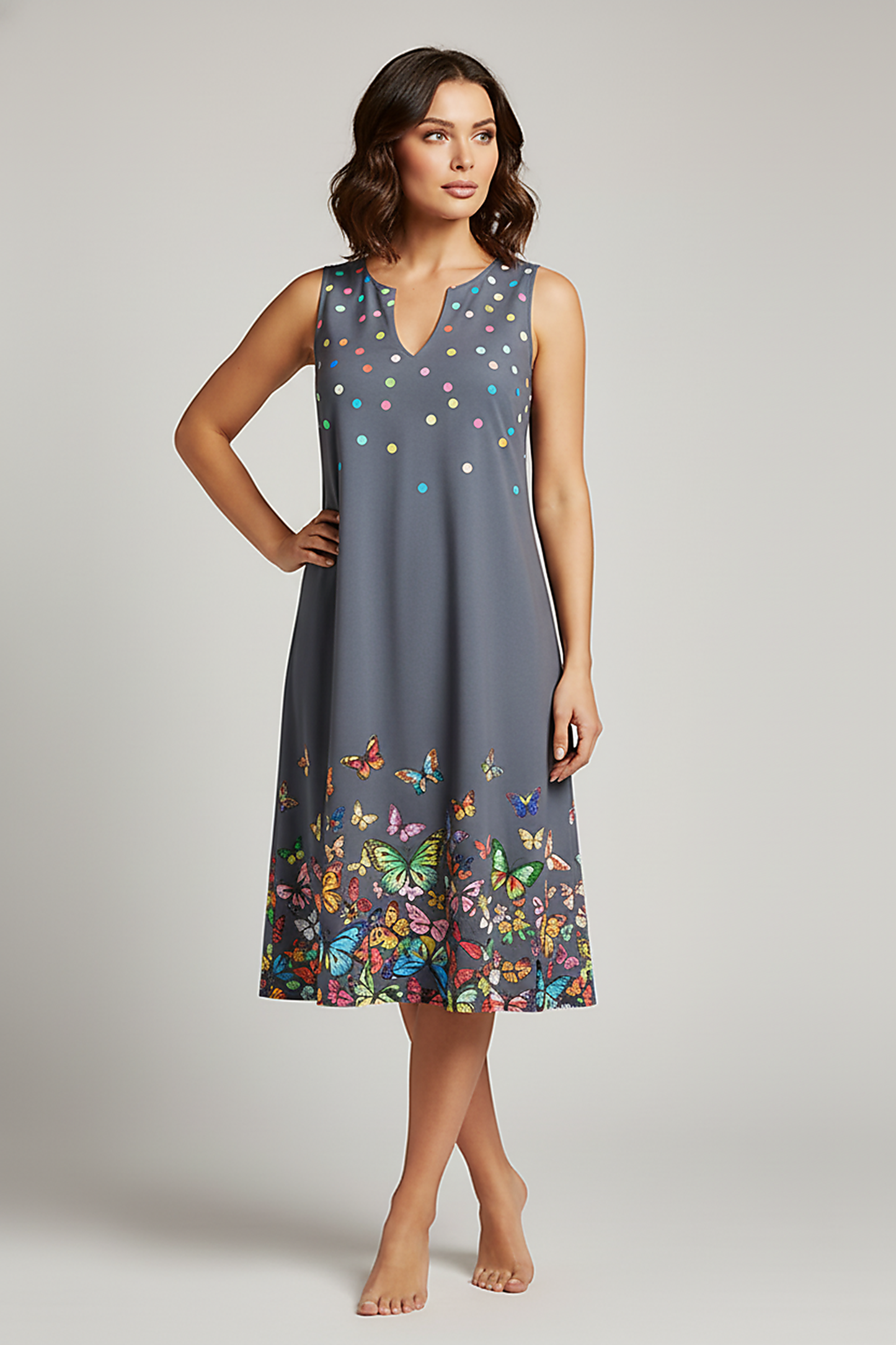 V-neck sleeveless printed resort dress, outdoor lifestyle view.