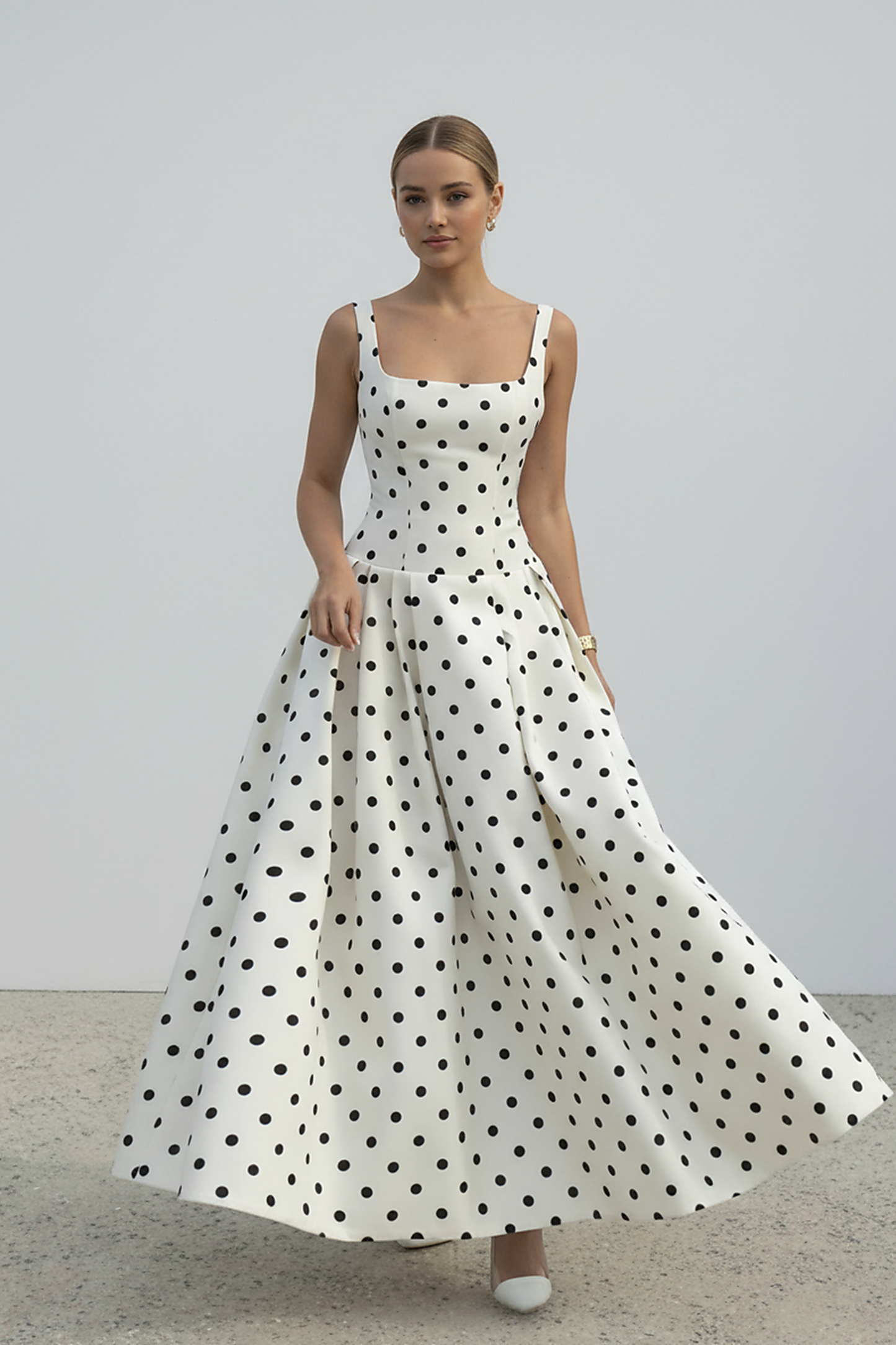 Polka dot maxi dress, side view on model.