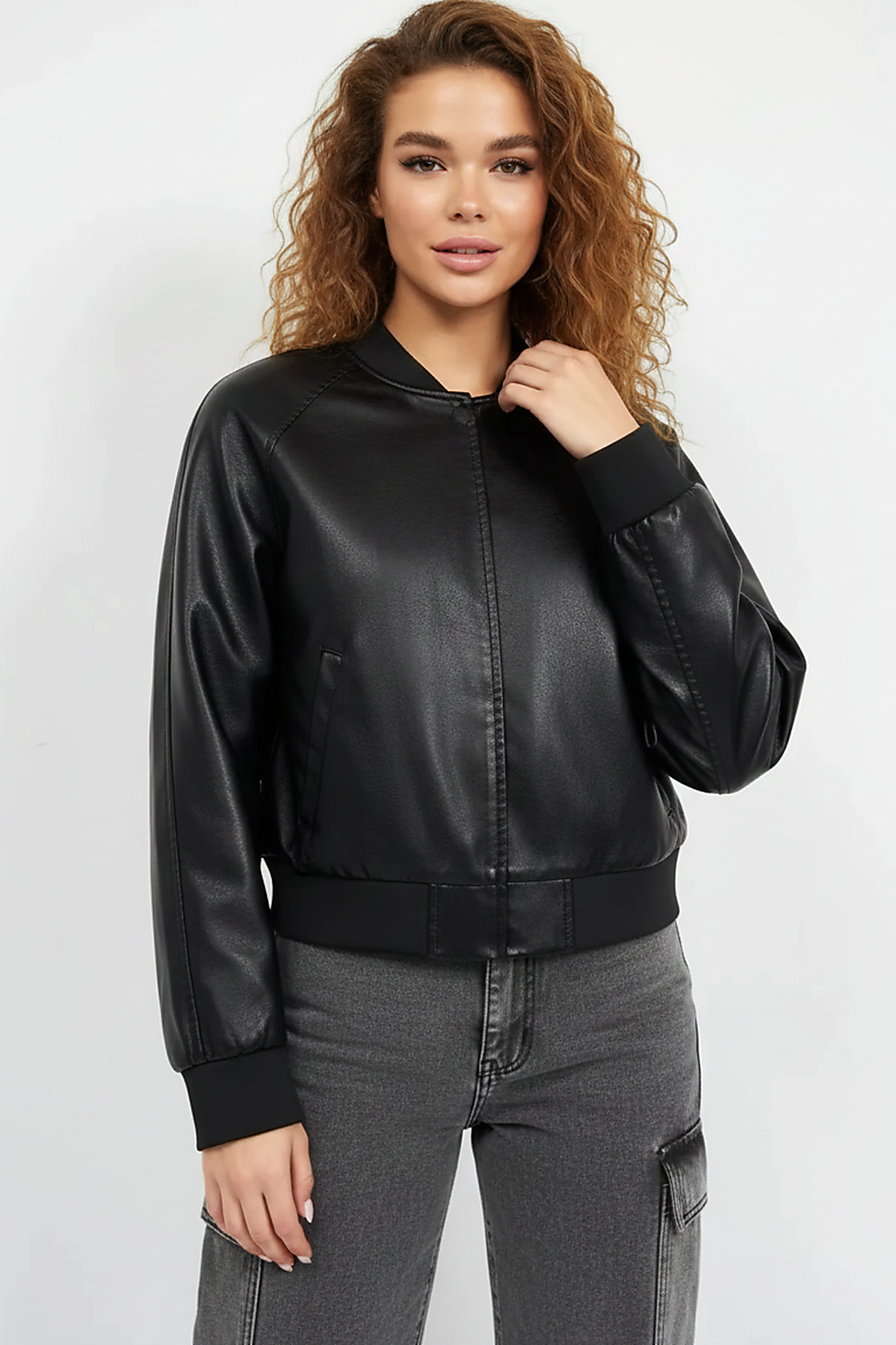 Black PU motorcycle jacket, front view on model.