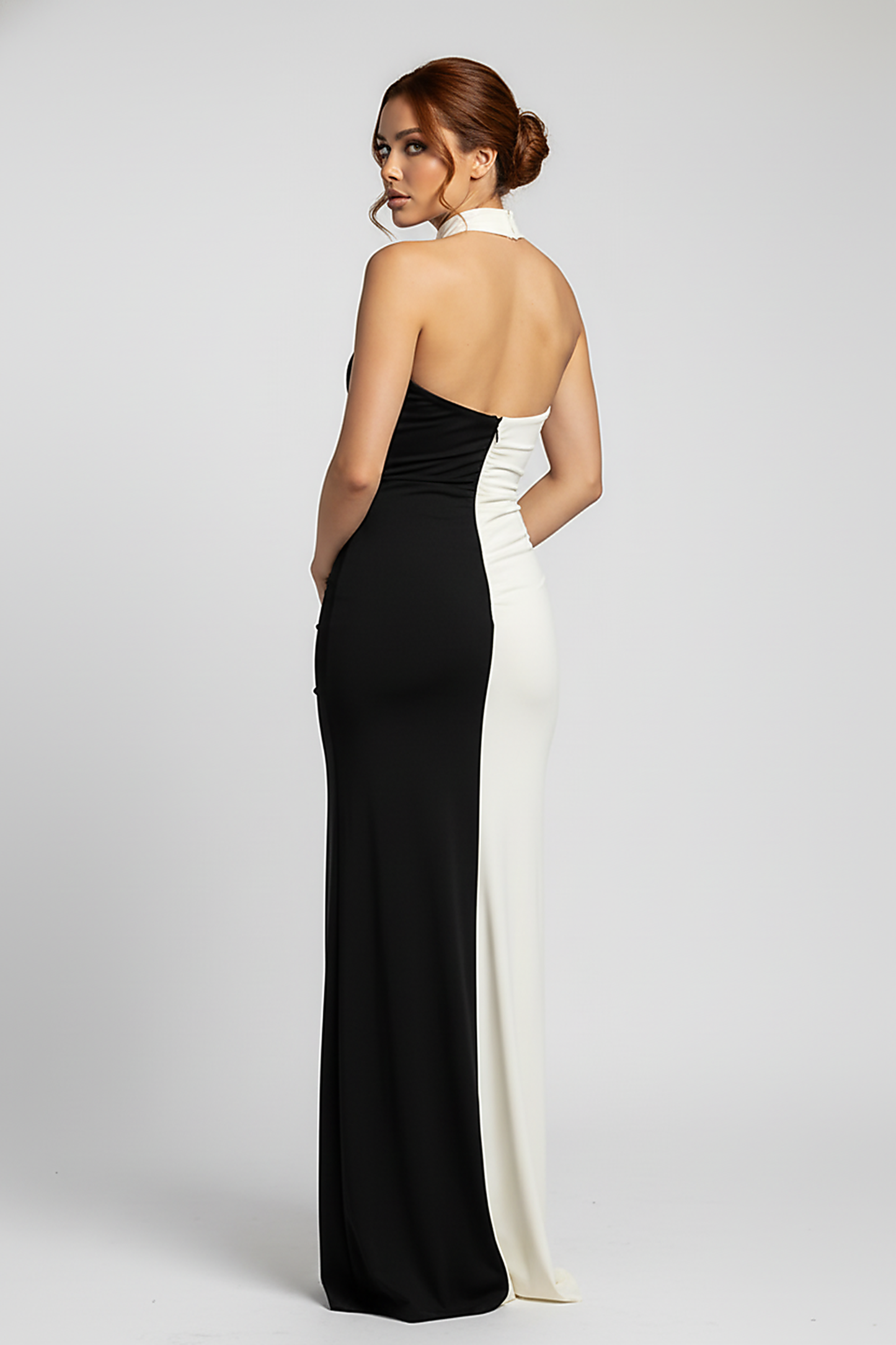 Contrast patchwork halter backless split maxi dress, back view on model.