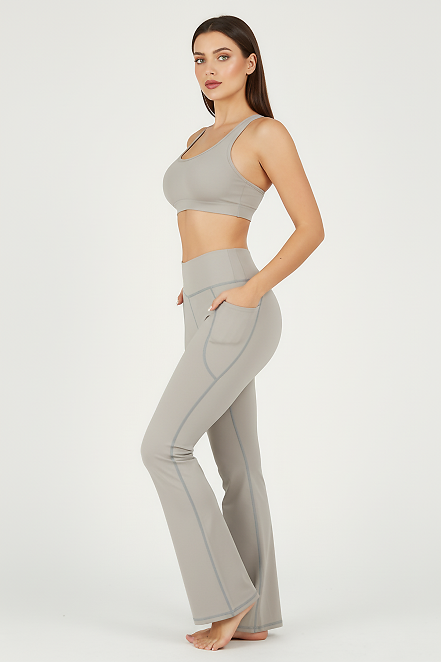 Black bootcut yoga pants, alternate angle view on model.