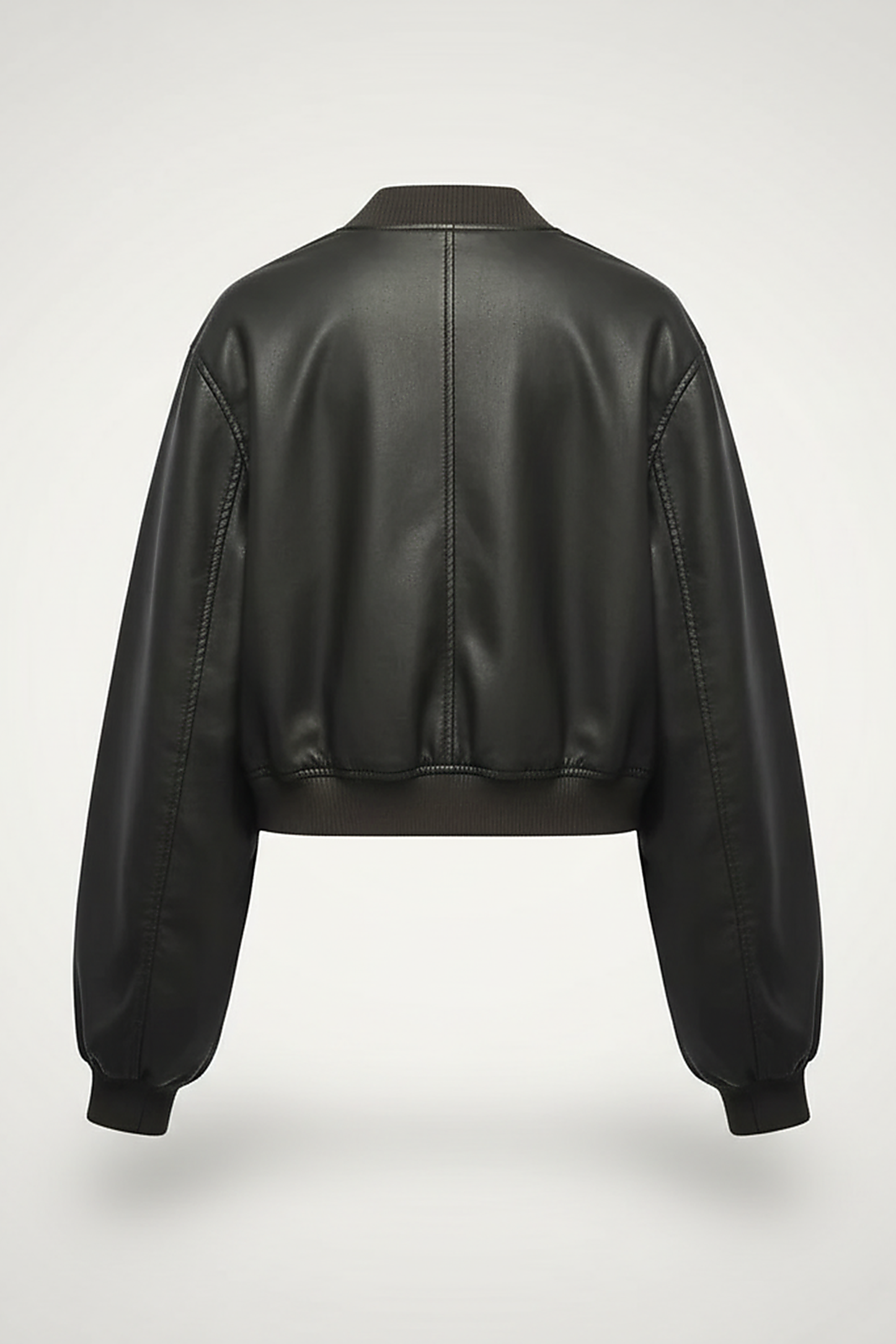 Distressed faux leather bomber jacket, model wearing it casually.