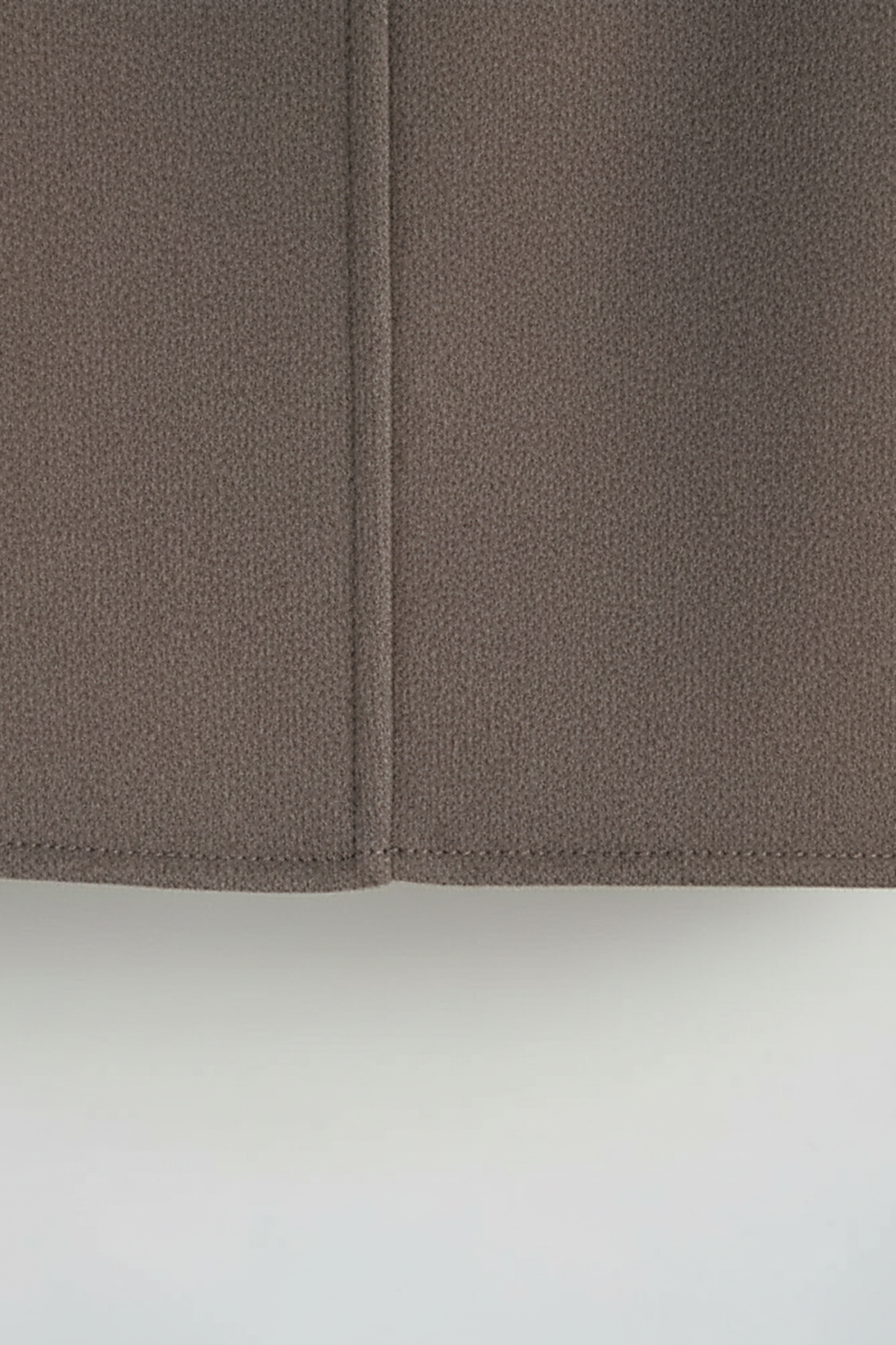 Women's solid wool jacket, styled with accessories.