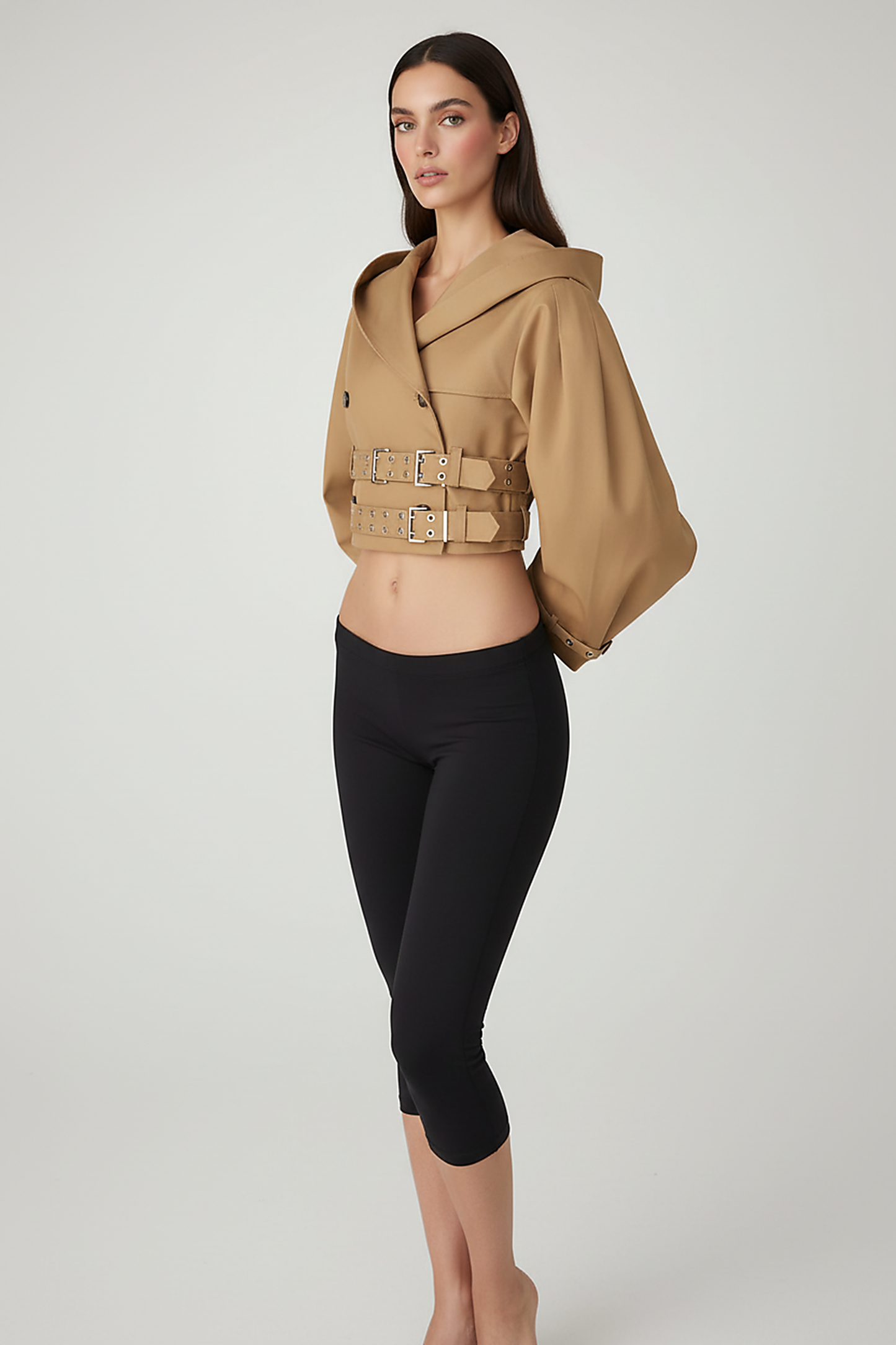 Black hooded crop trench coat, back view on model.