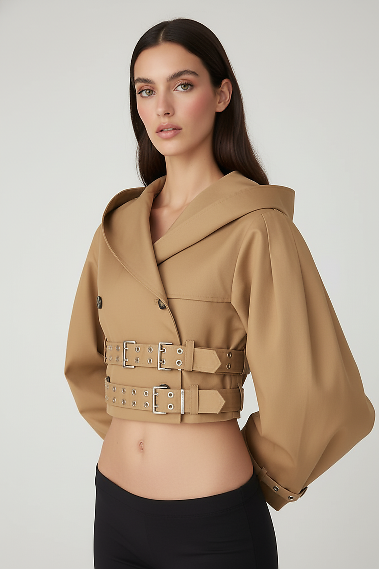 Black hooded crop trench coat, close-up of pocket.