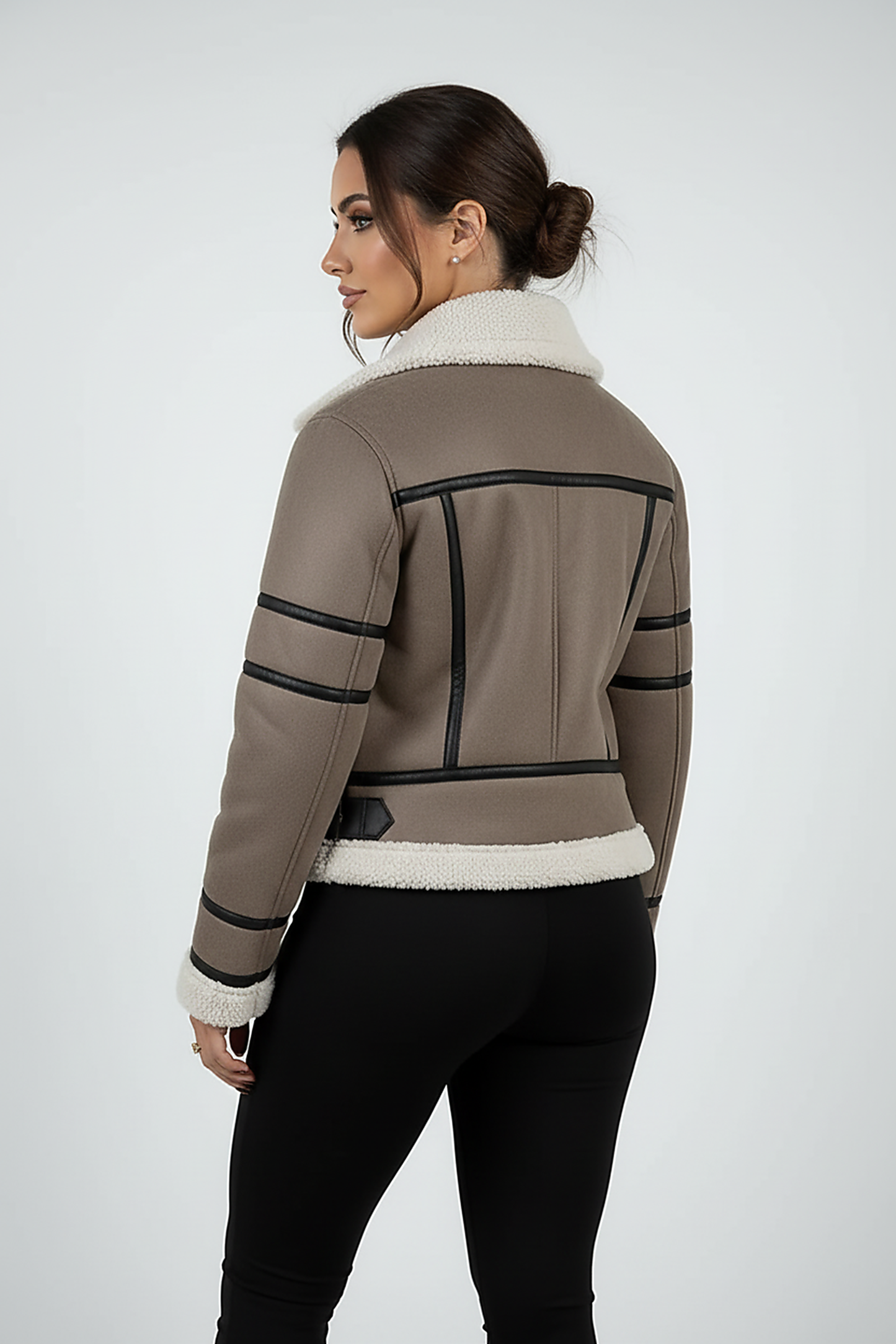 Cream synthetic sheepskin bomber jacket, fabric texture close-up.