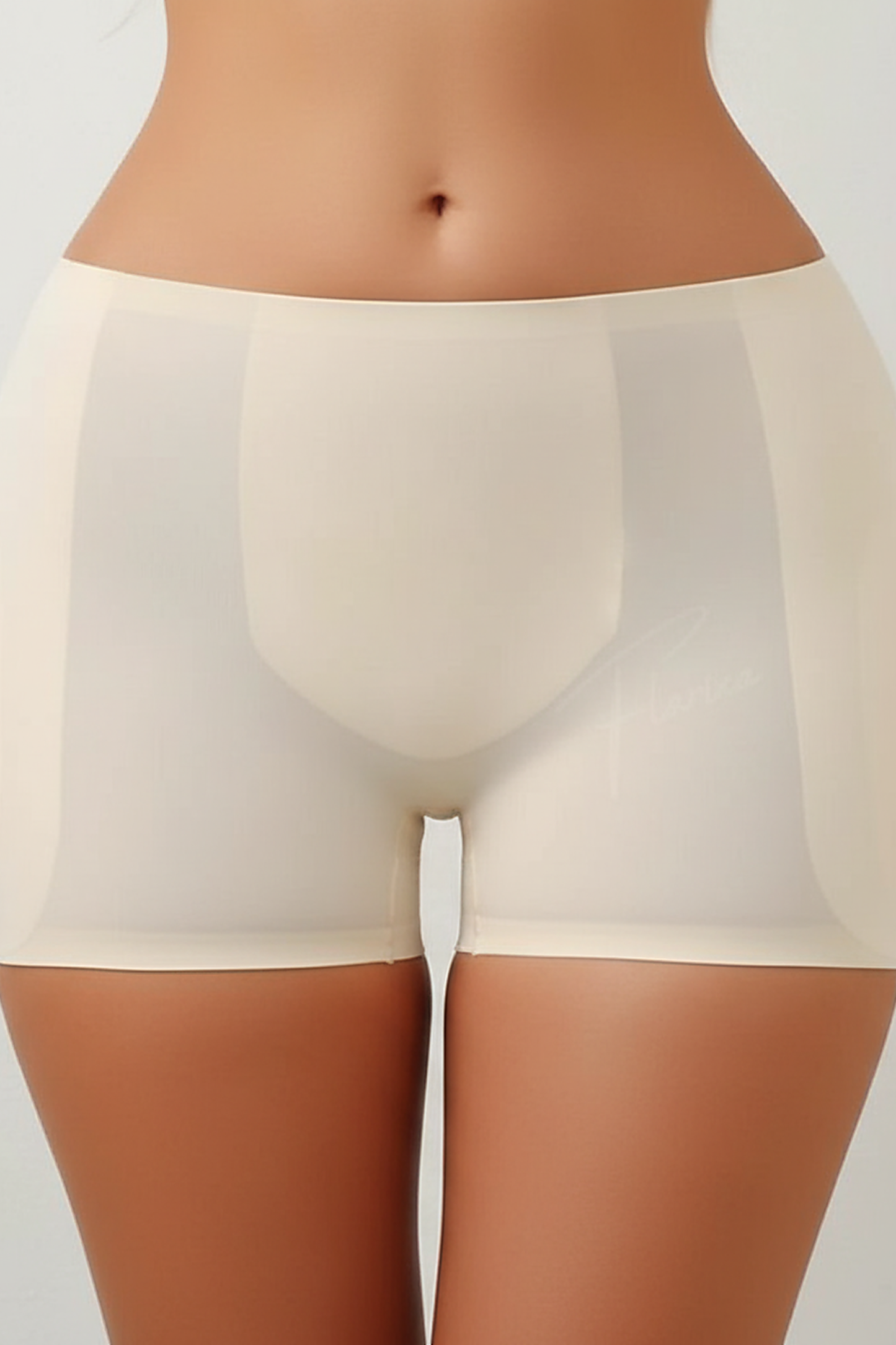 Shapewear panties with hip pads, fabric detail.
