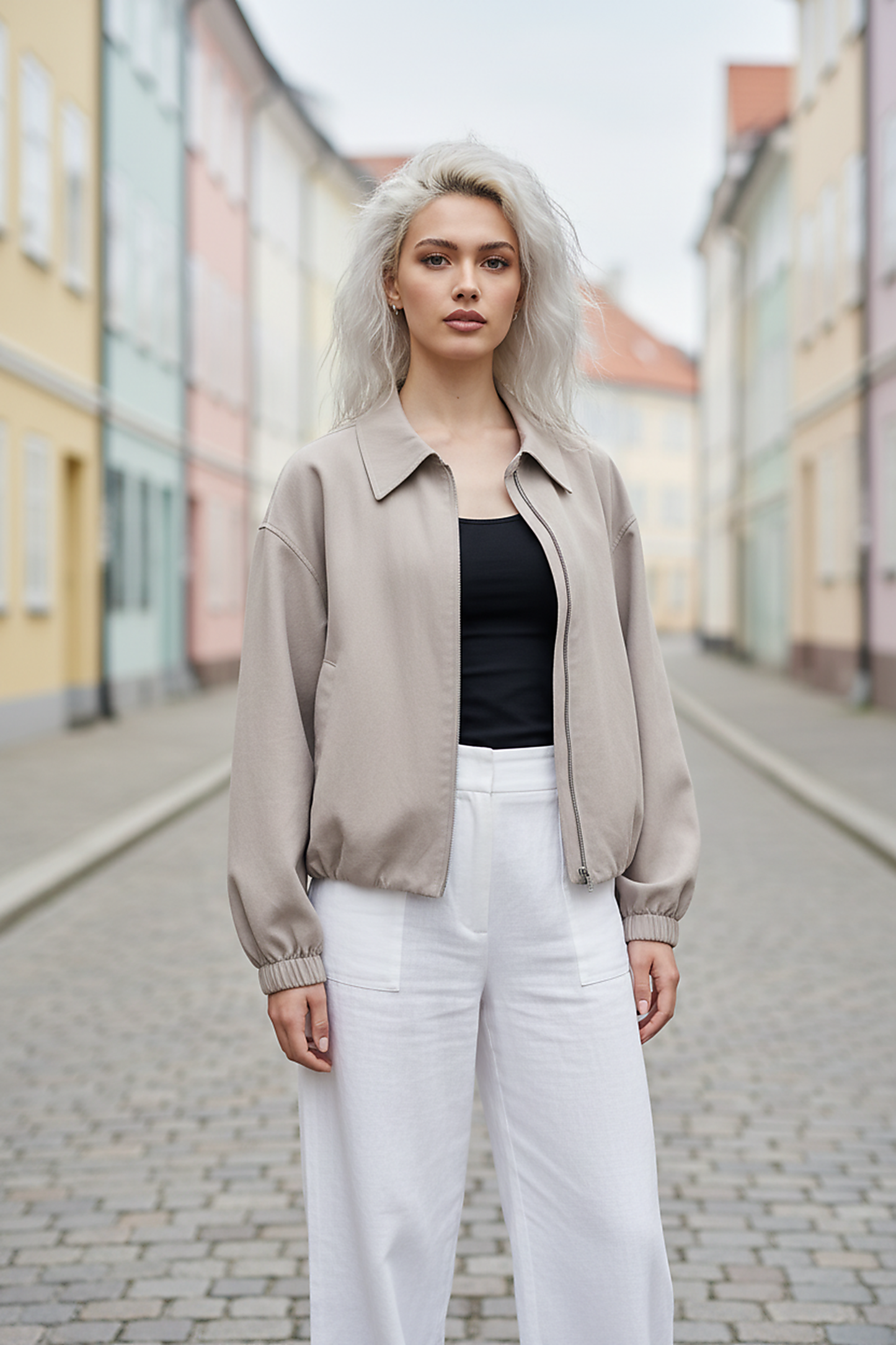 Beige short jacket, fabric texture detail.