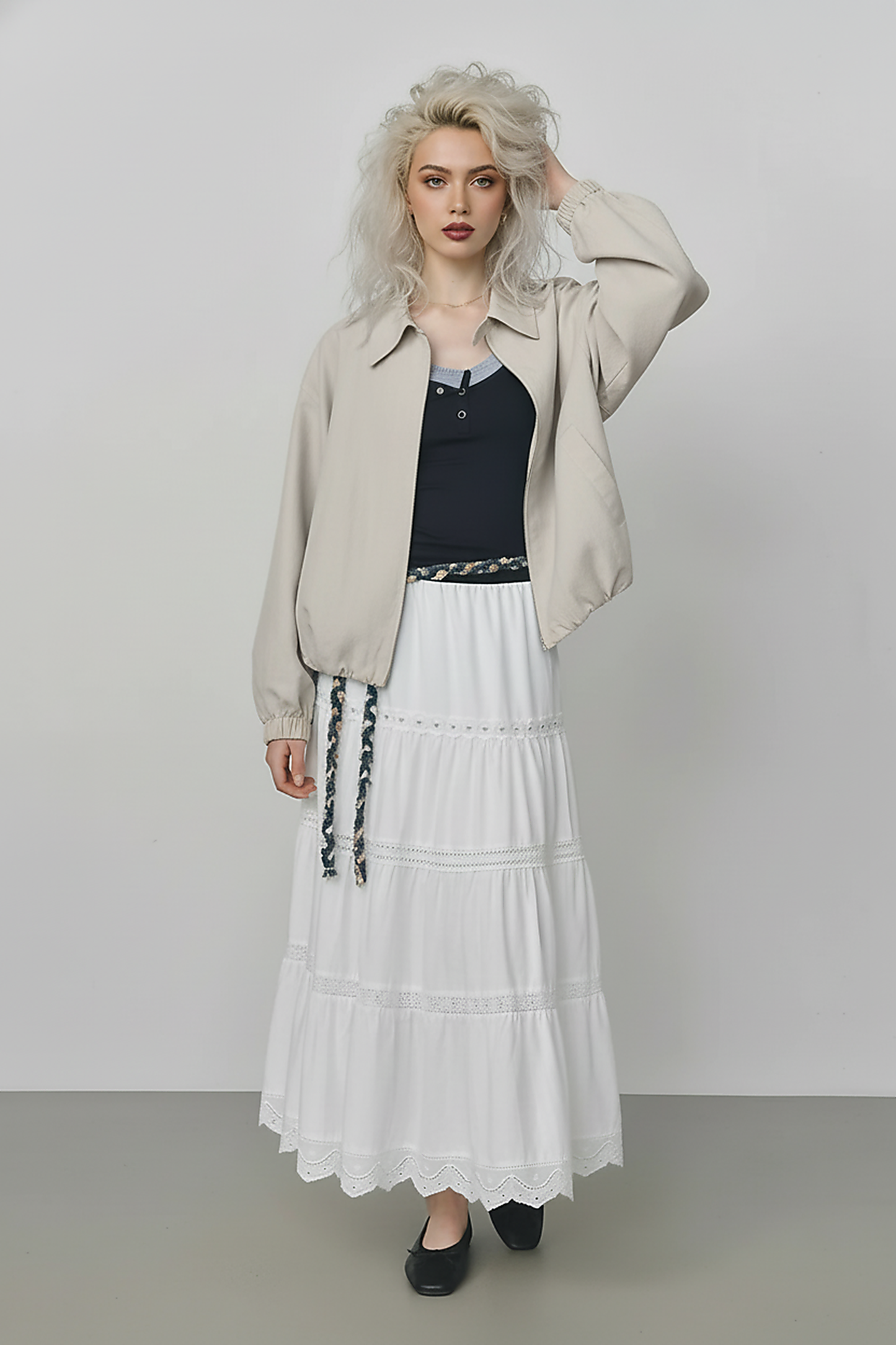 Beige short jacket, hem detail.