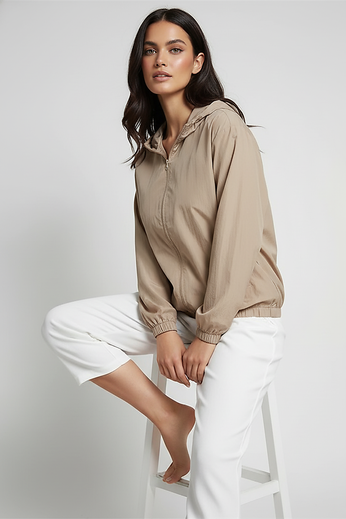 Orange transparent hooded jacket, front zipper detail.