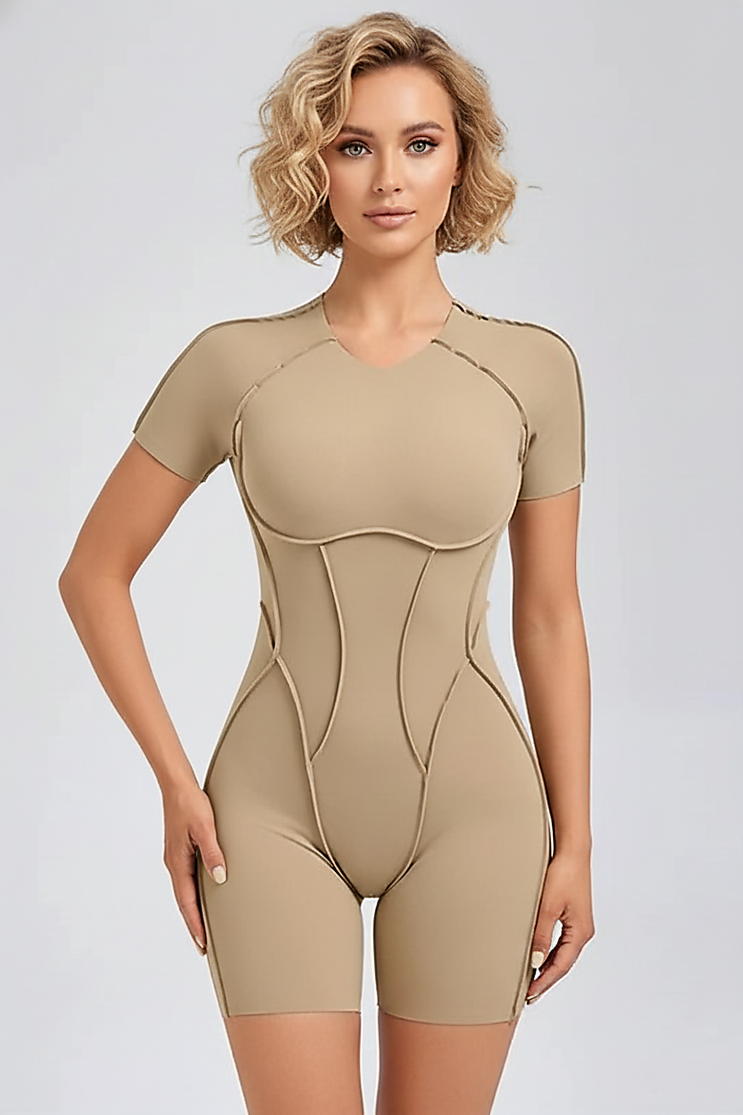 Black workout jumpsuit, front view on model.