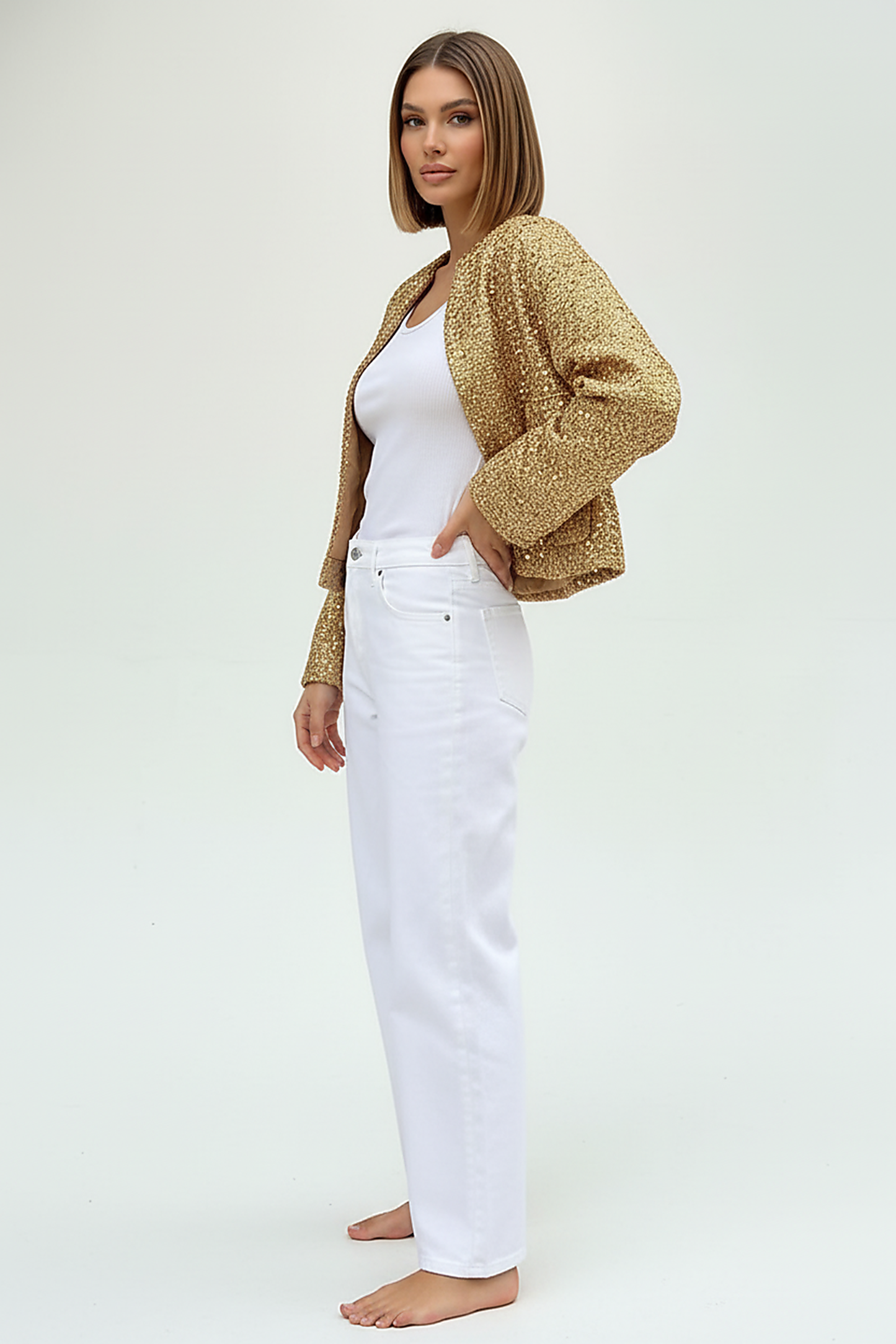 Gold sequin jacket, front view on model, different pose.