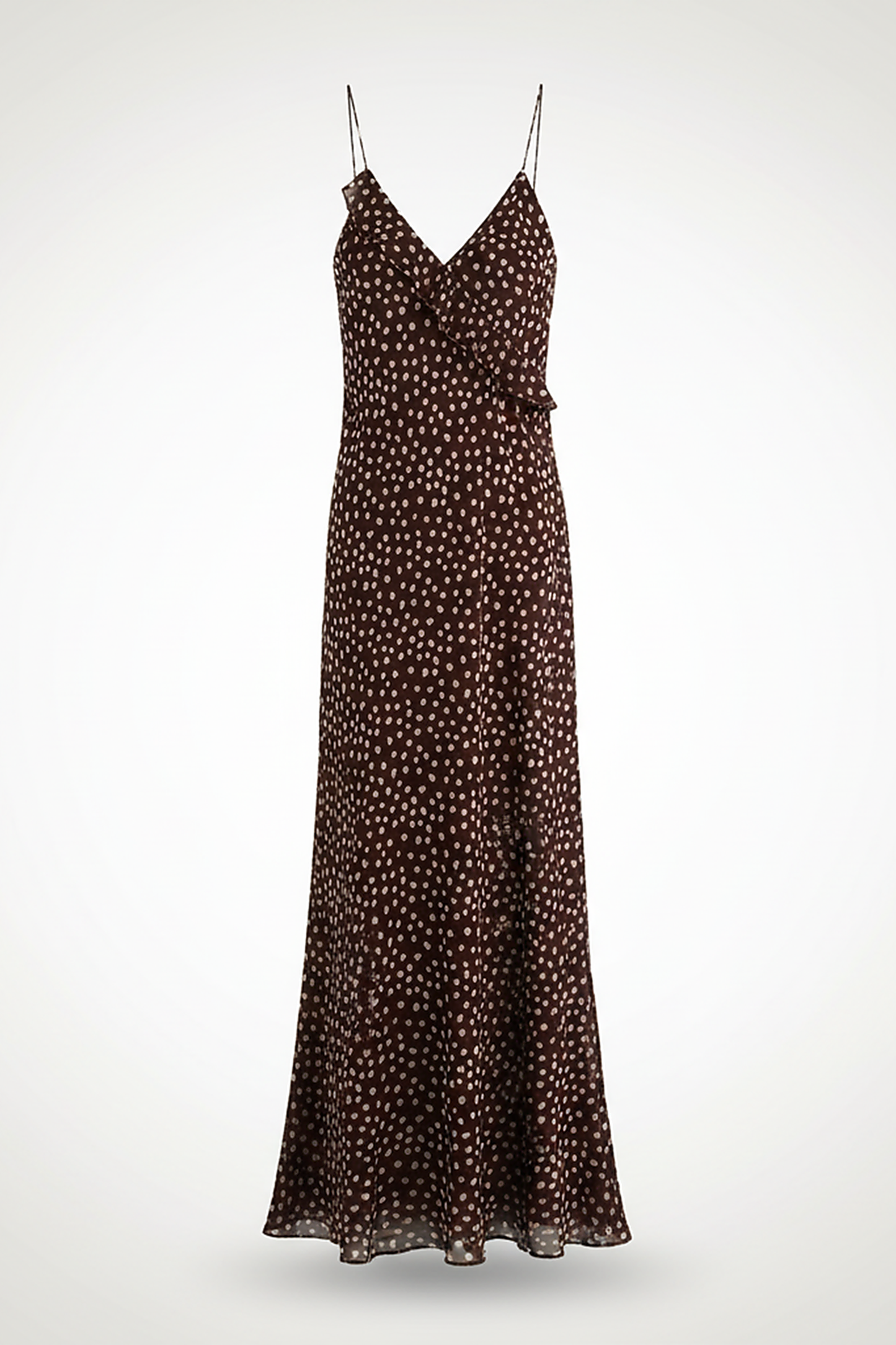 Flowy polka dot layered suspender sundress, front view on model.