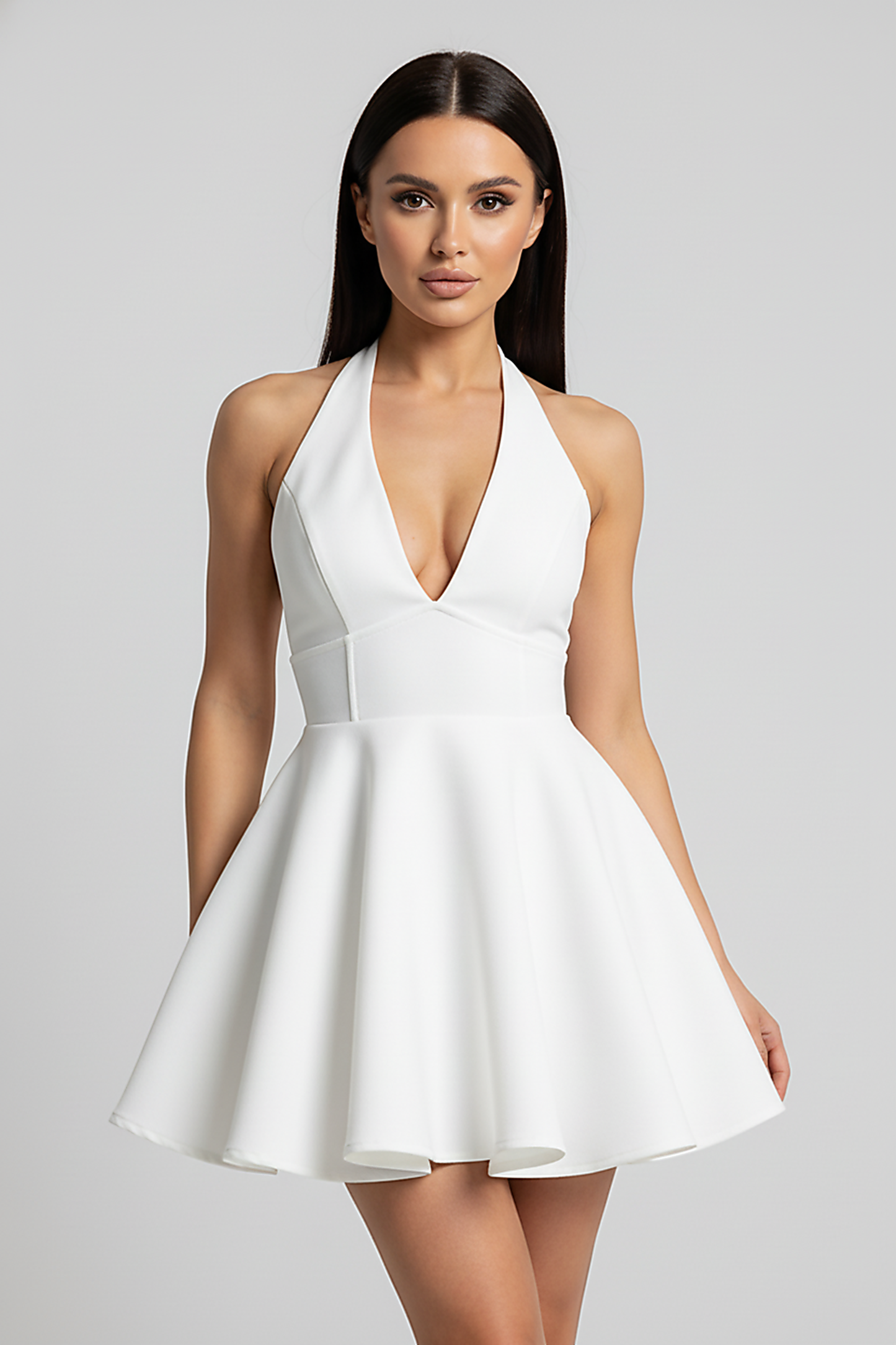 Halter V-neck pleated mini dress, half body view on smiling model.