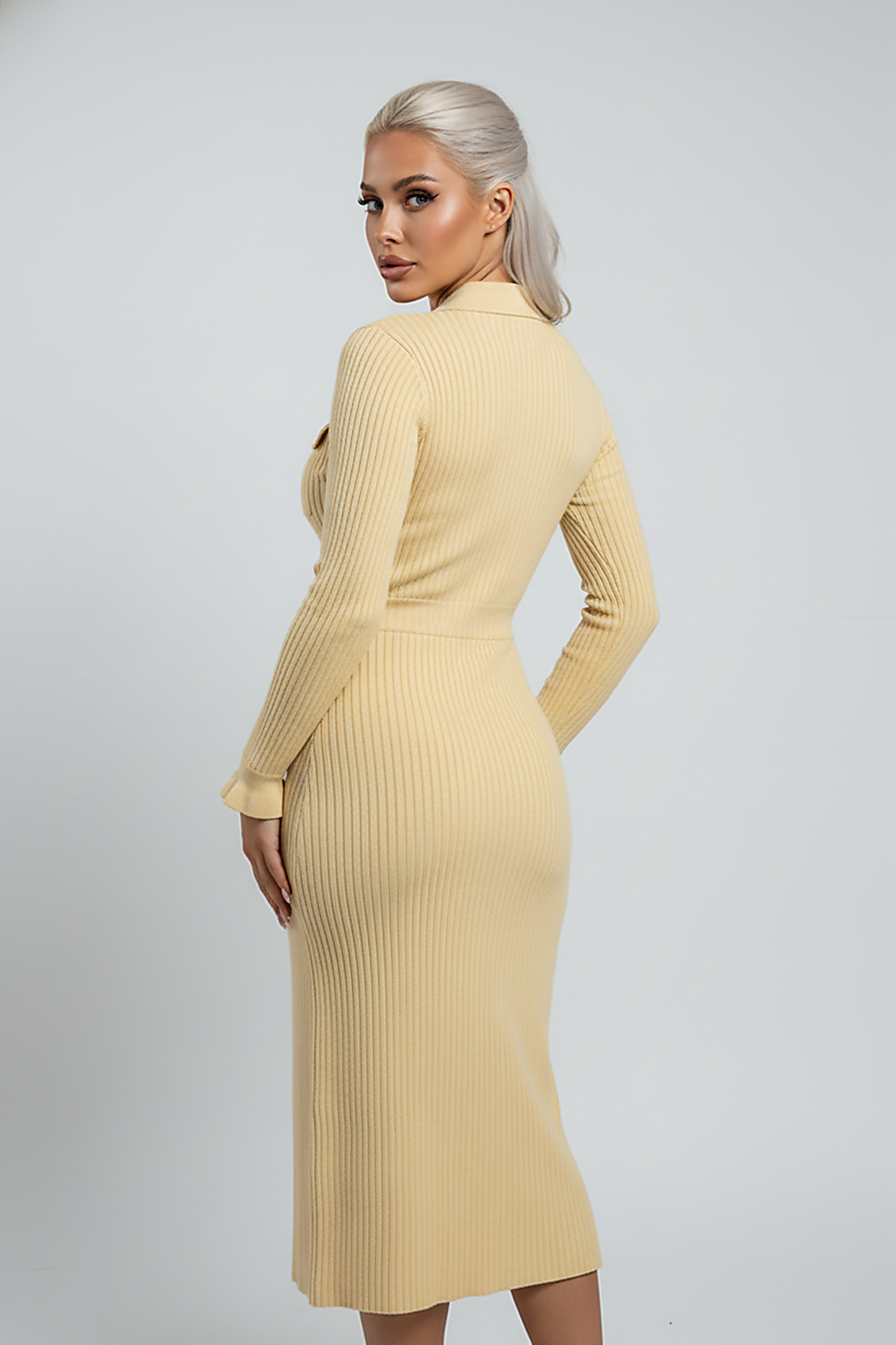 Cozy long-sleeve ruffle sweater dress, indoor lifestyle view on model.