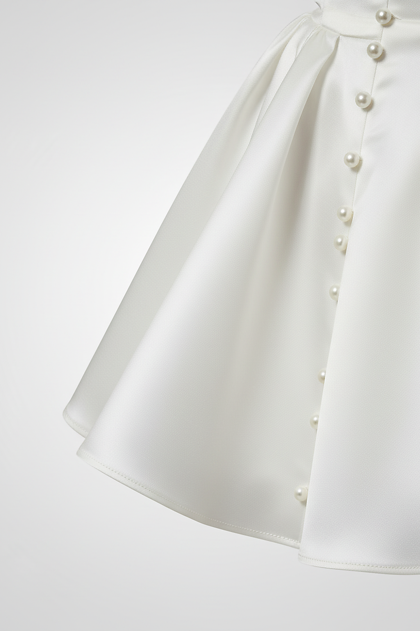 White short-sleeve mini dress, waist detail.