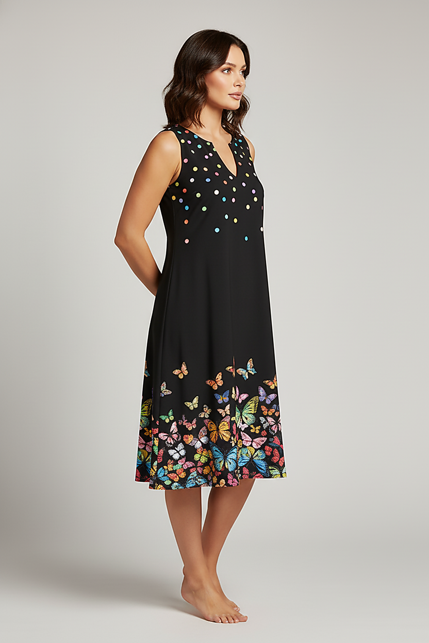 V-neck sleeveless patterned swing dress, front view on model.