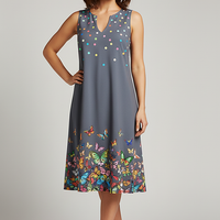 V-neck sleeveless printed resort dress, outdoor lifestyle view.