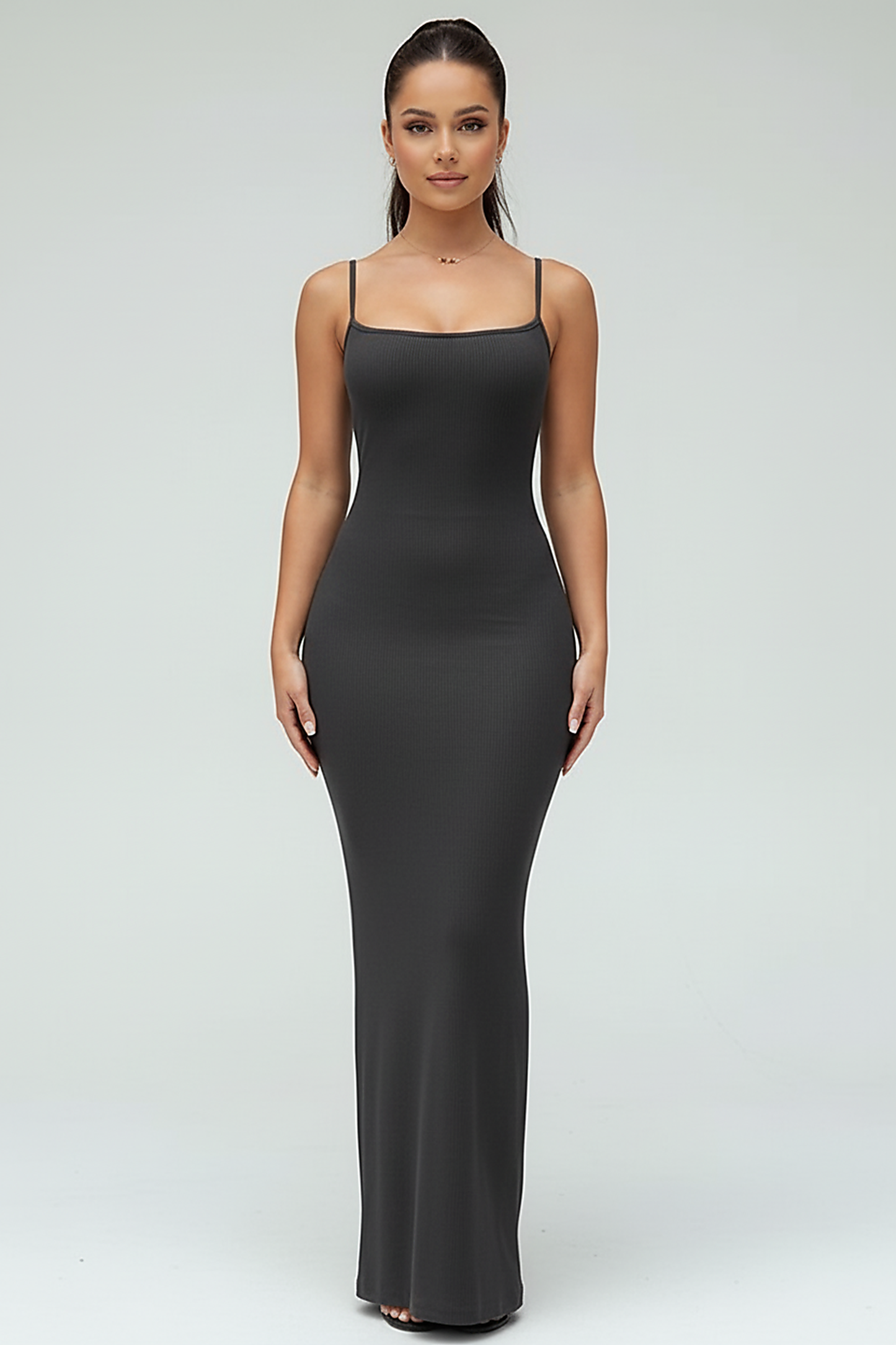 Black spaghetti strap long dress, back view on model.