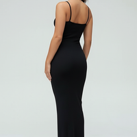 Black spaghetti strap long dress, side view on model.