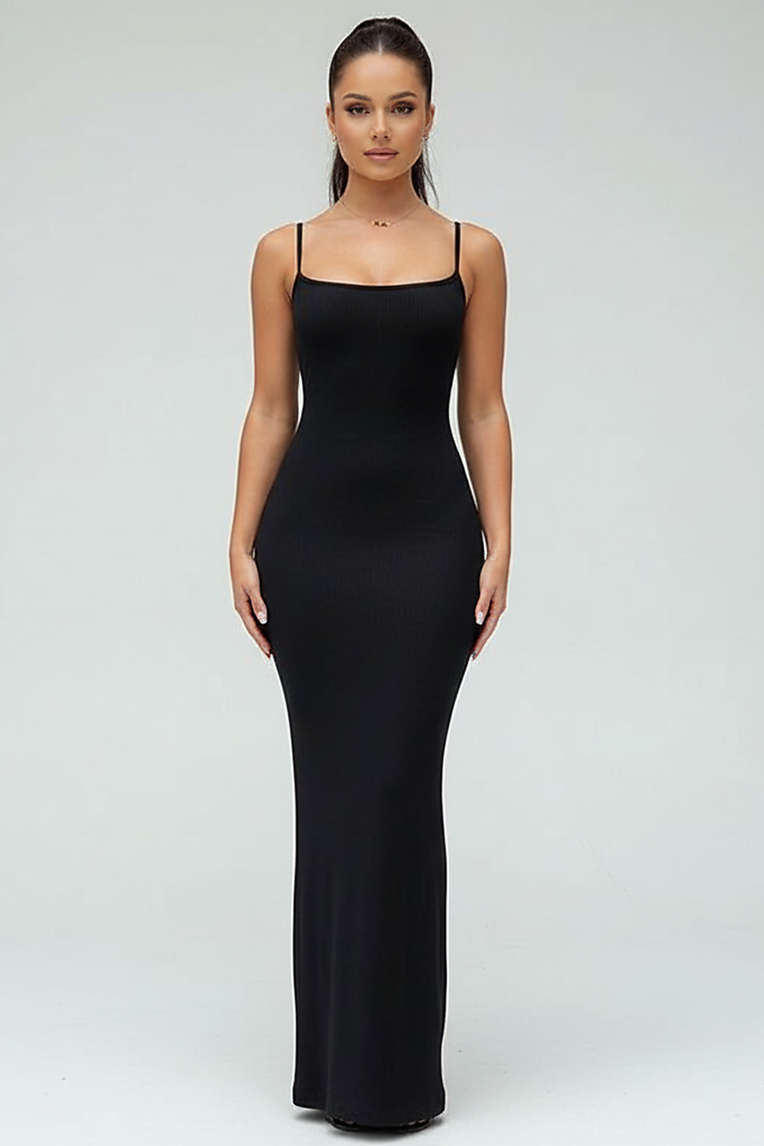 Black spaghetti strap long dress, front view on model.