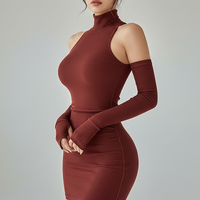 Sleeveless pleated mini dress with high-neck and lace-up, front view on model.