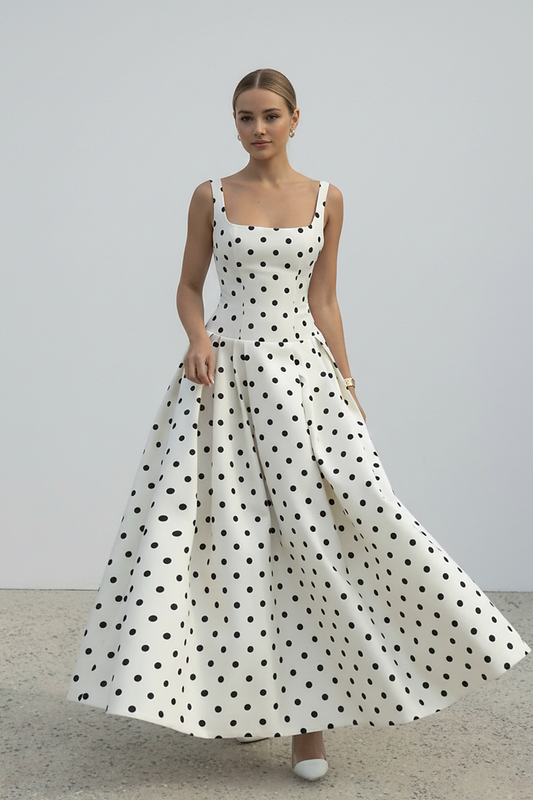 Polka dot maxi dress, side view on model.