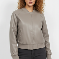 Black PU motorcycle jacket, fabric texture close-up.