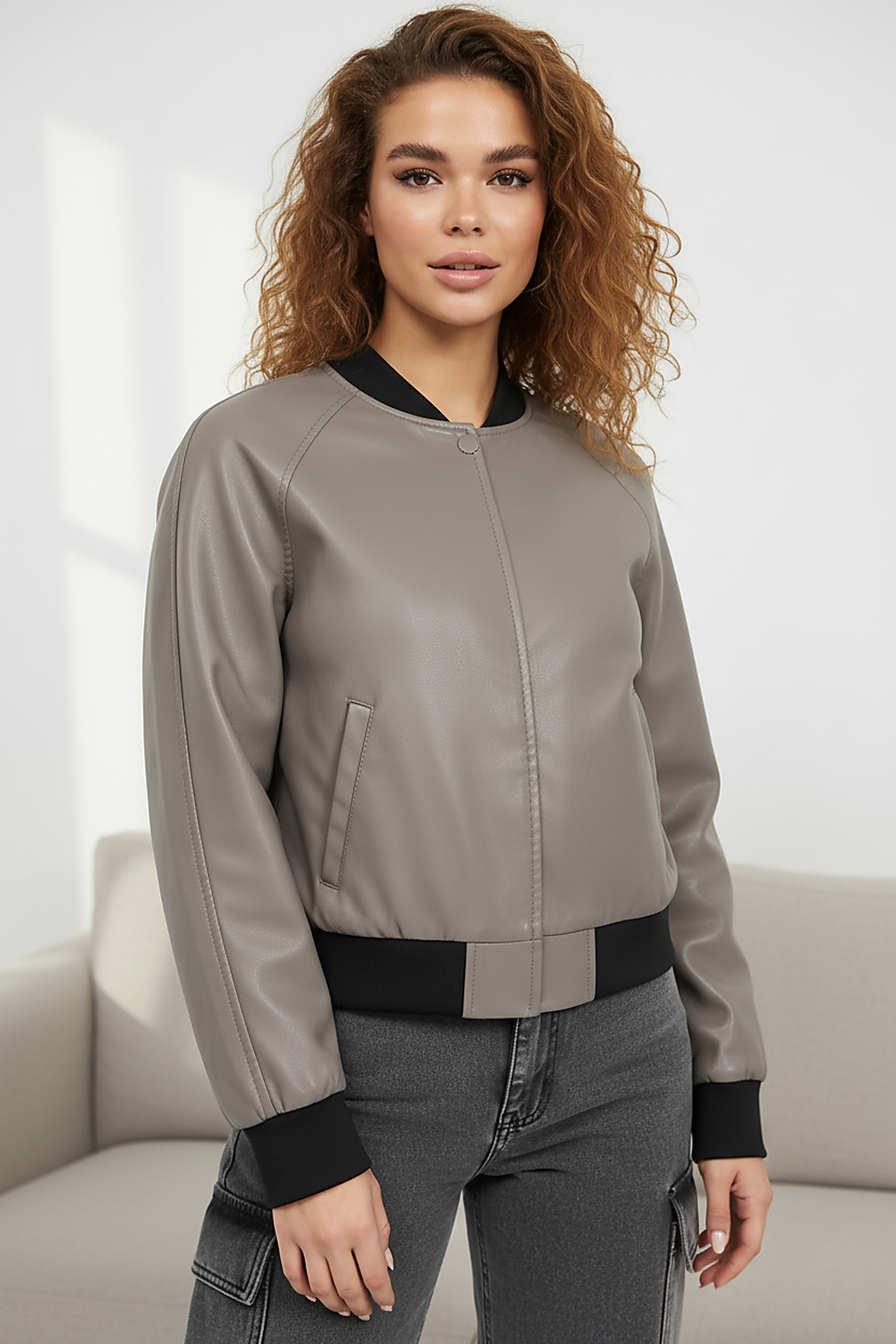 Black PU motorcycle jacket, waist hem detail.