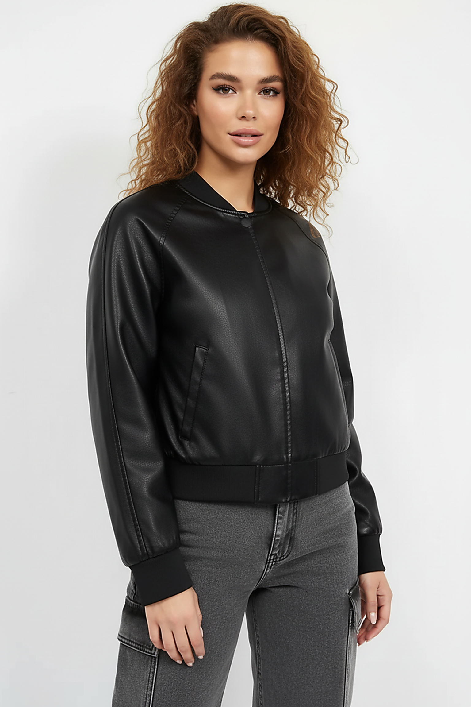 Black PU motorcycle jacket, shoulder and arm detail.
