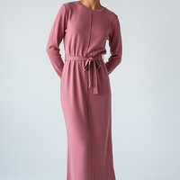 woman wearing a dark plum mini dress, front view, standing, hands relaxed