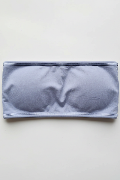 Black backless bandeau sports bra, side view on model.