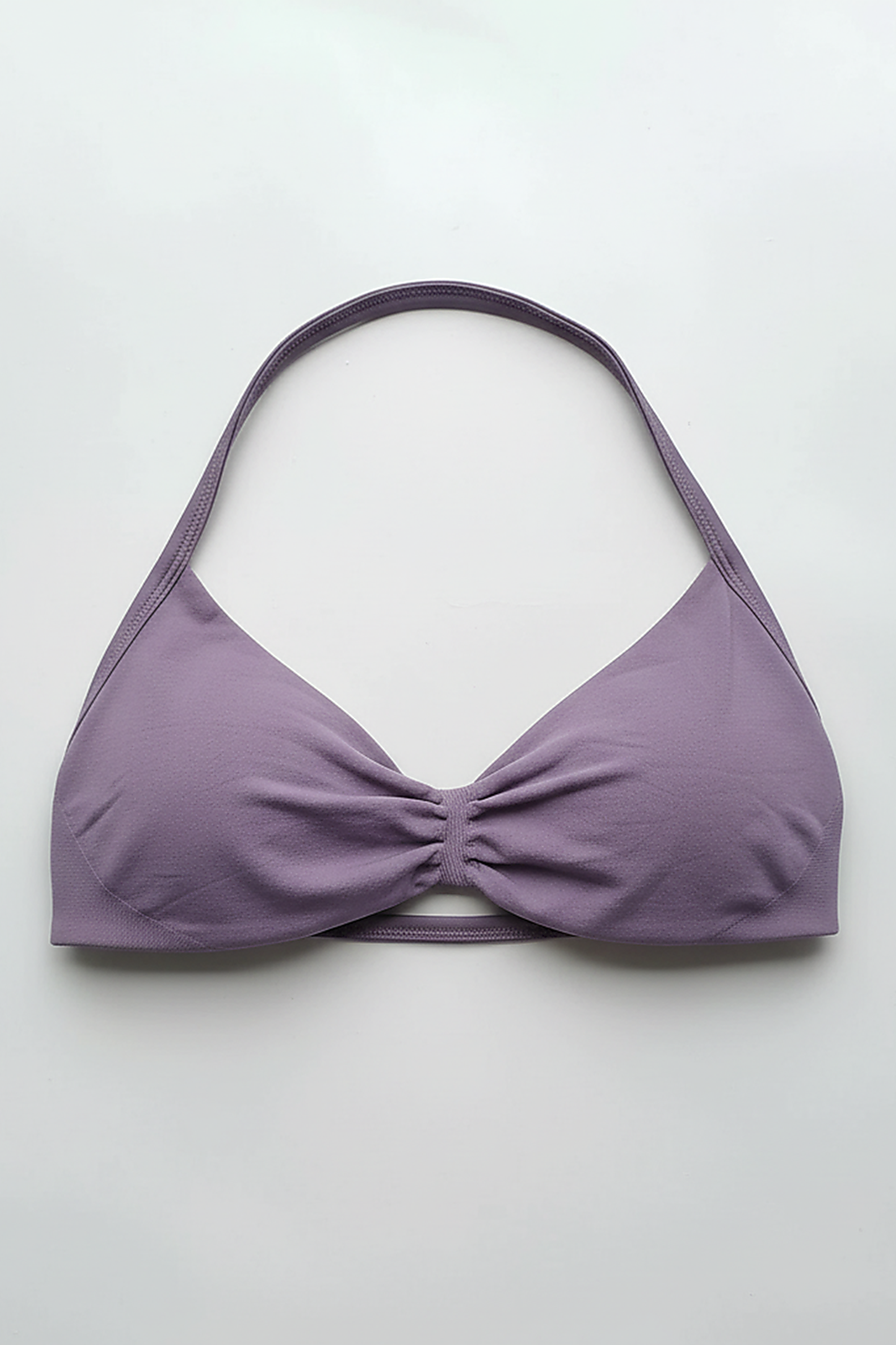 Strappy sports bra, angled view on model.