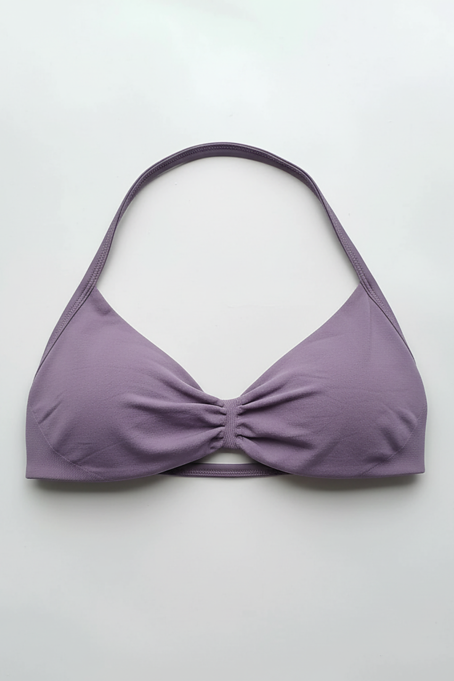 Strappy sports bra, angled view on model.