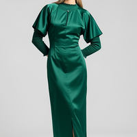 woman wearing light blue satin maxi dress, front view, standing, hands relaxed