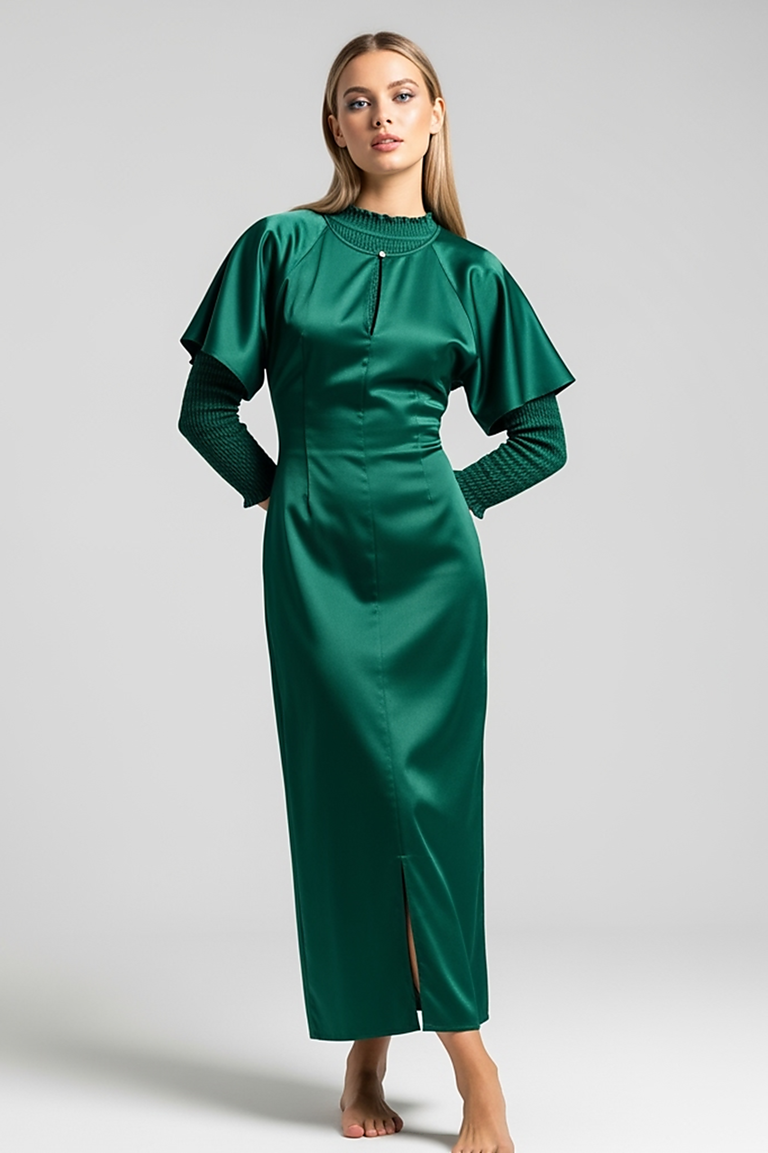 woman wearing light blue satin maxi dress, front view, standing, hands relaxed