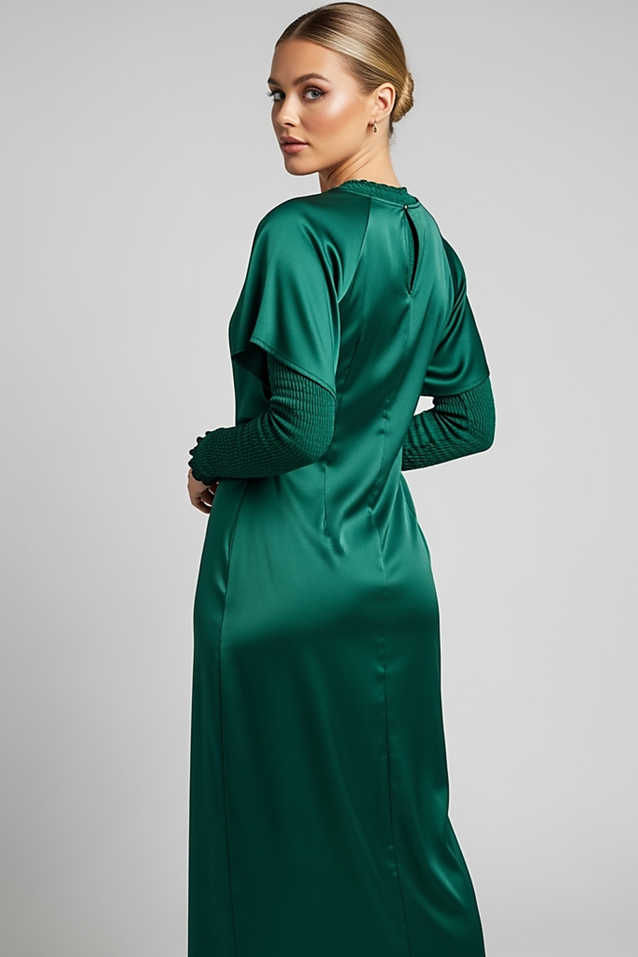 woman wearing light blue satin maxi dress, front view, standing, hands relaxed