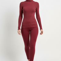 Women's knitted pullover sweater, back view on model.