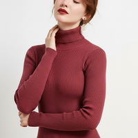 Women's knitted pullover sweater, side view on model.