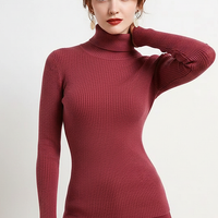 Women's knitted pullover sweater, front view on model.