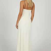 Black mesh spaghetti strap dress, side view, model looking away.