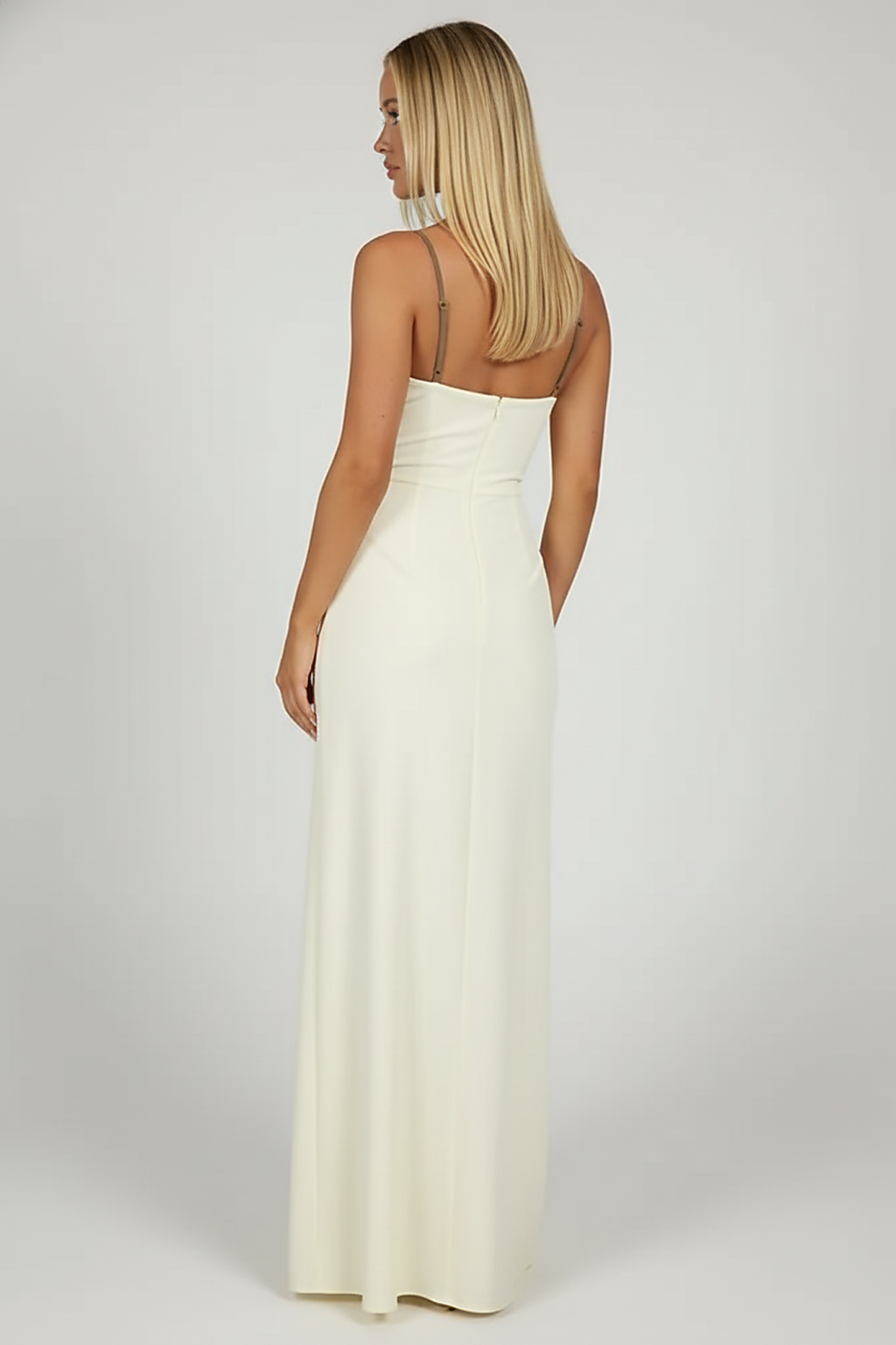 Black mesh spaghetti strap dress, side view, model looking away.