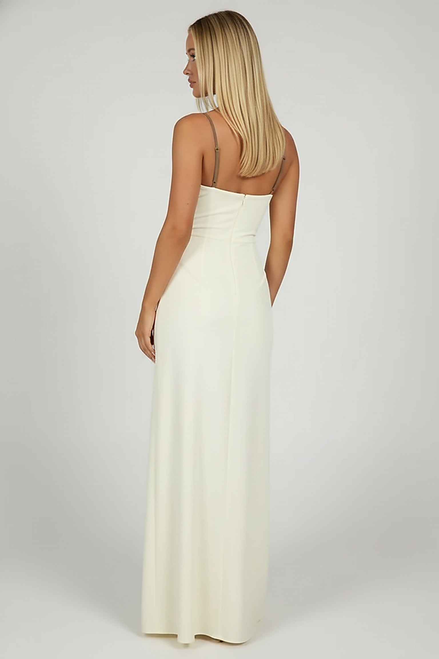 Black mesh spaghetti strap dress, side view, model looking away.