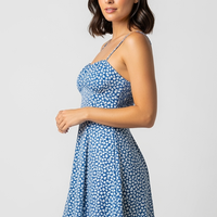 woman wearing white maxi dress with ruffles and lace, front view, standing, hands relaxed