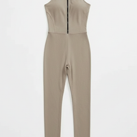 Green sporty jumpsuit, front view on model.