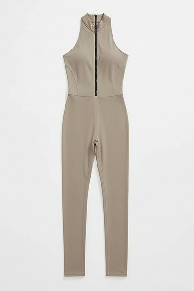 Green sporty jumpsuit, front view on model.