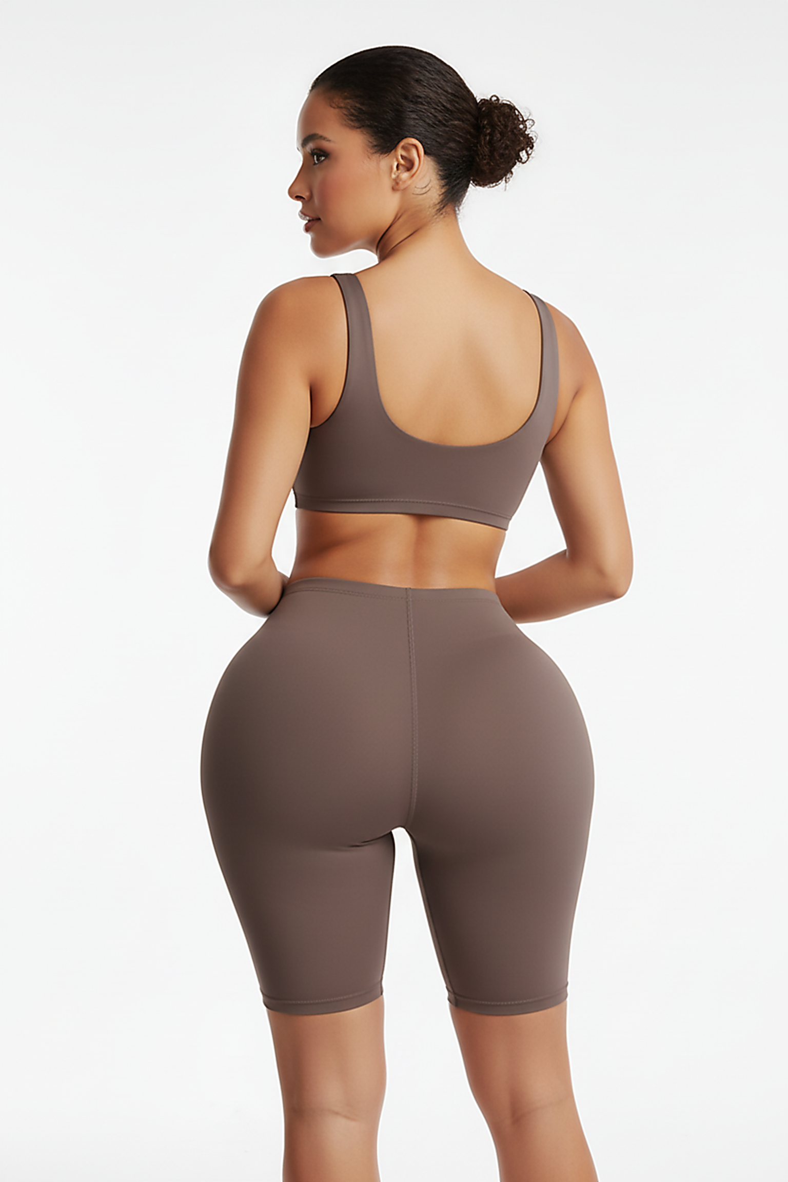 Shapewear butt lifter panties, back view on model.