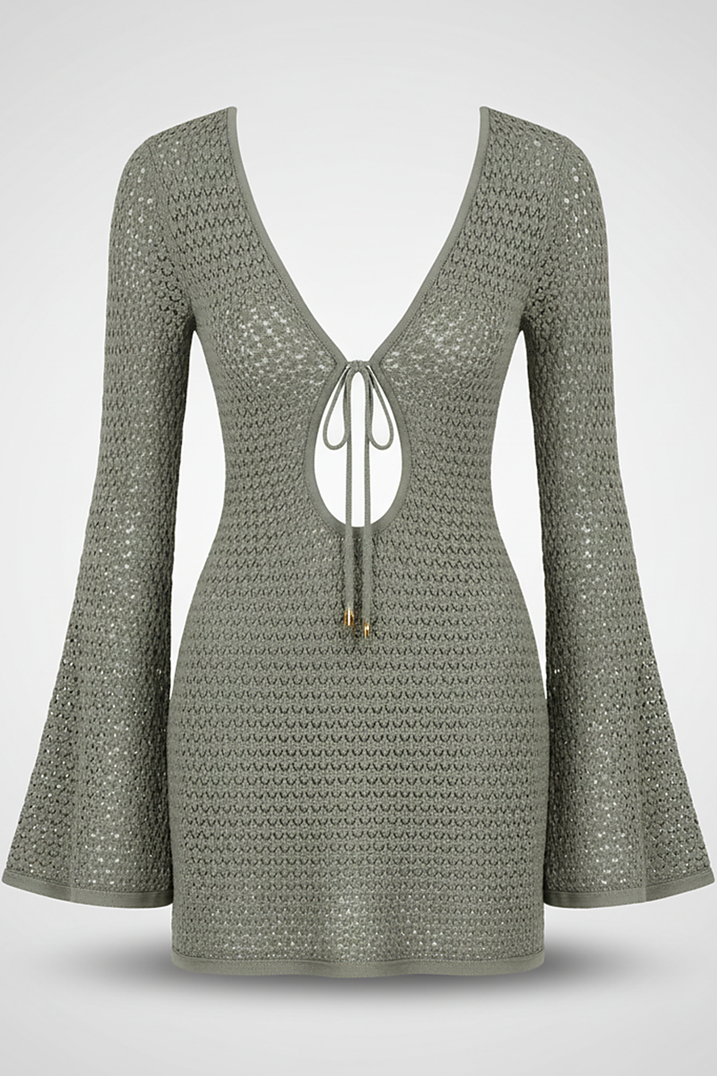 Hollow-out knit short dress, lifestyle shot on model.