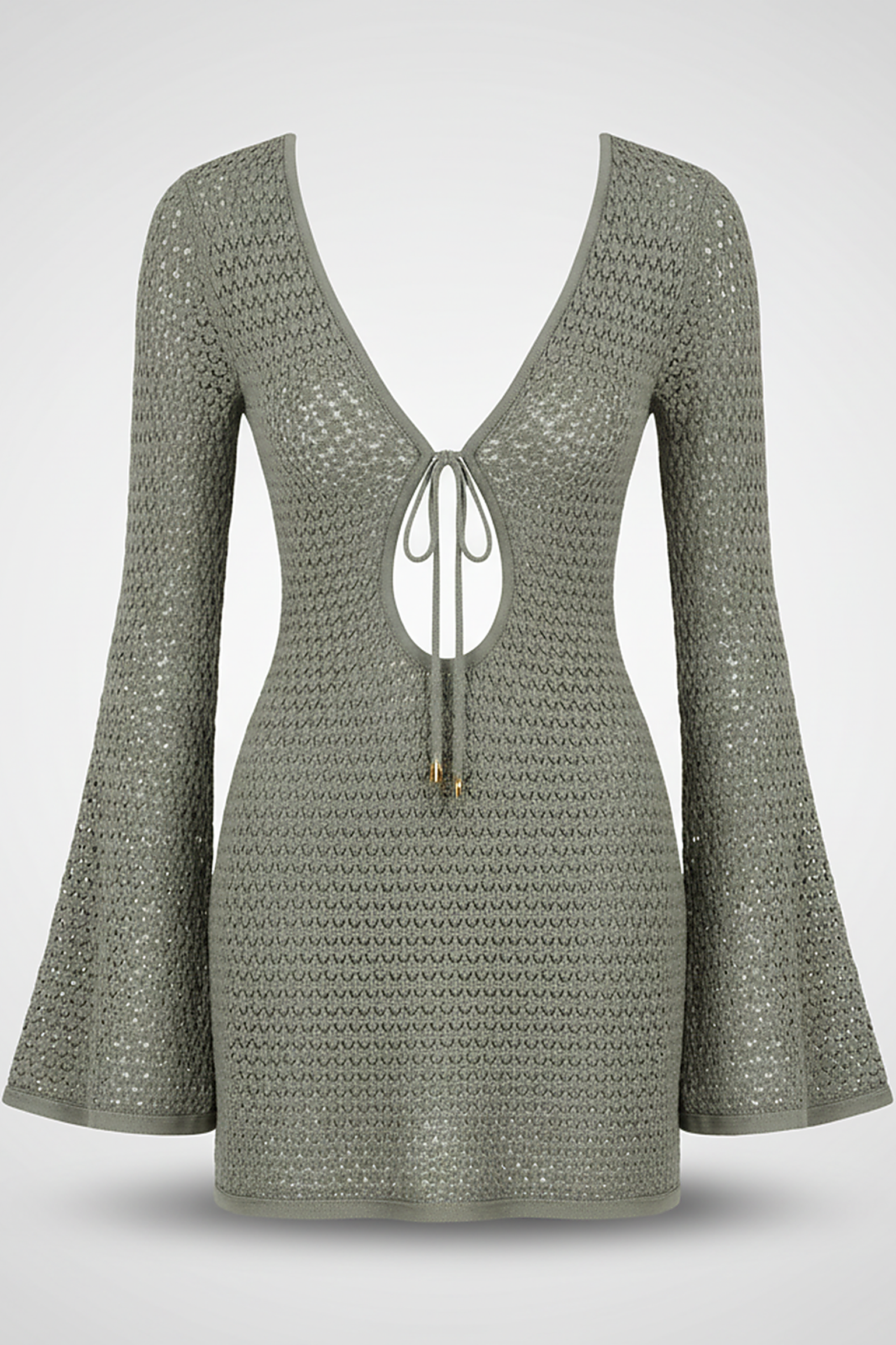 Hollow-out knit short dress, lifestyle shot on model.