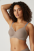 Neutral bralette, angled side view on model.